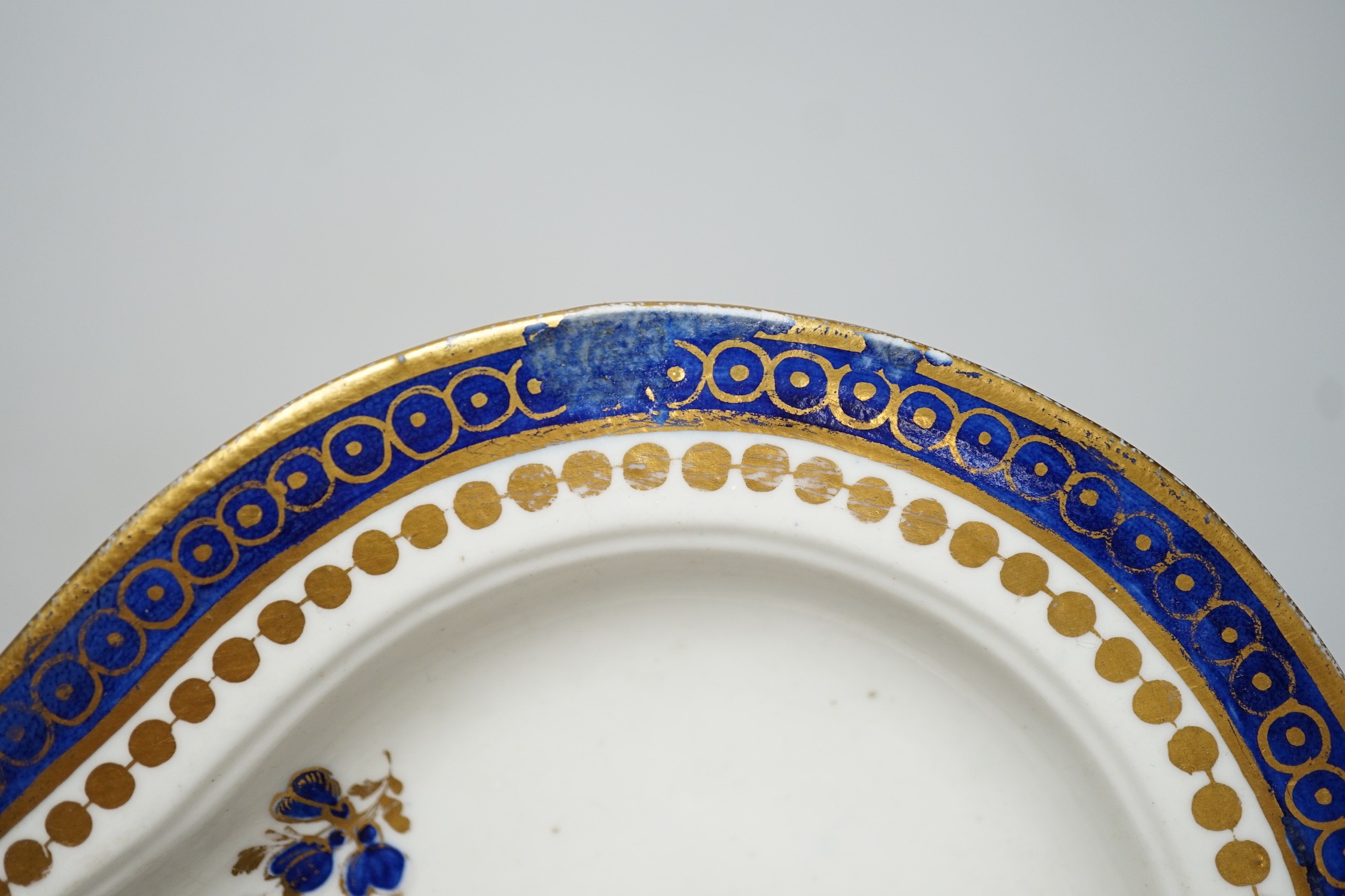 An 18th century Caughley tureen cover and stand with blue and gilt decoration, stand mis-fired to border, S mark to stand and base. 15cm wide
